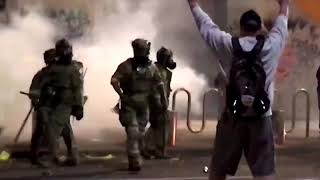 WARNING GRAPHIC CONTENT  US riot police use tear gas hit Portland protester with batons [upl. by Ecnirp234]